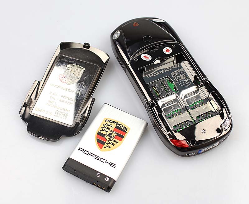 Телефон машинка купить. Мобильный телефон (Porsche q5). Porsche Cayman s телефон сотовый. Телефон Porsche Ox-977gts. Мобильный телефон в форме автомобиля.